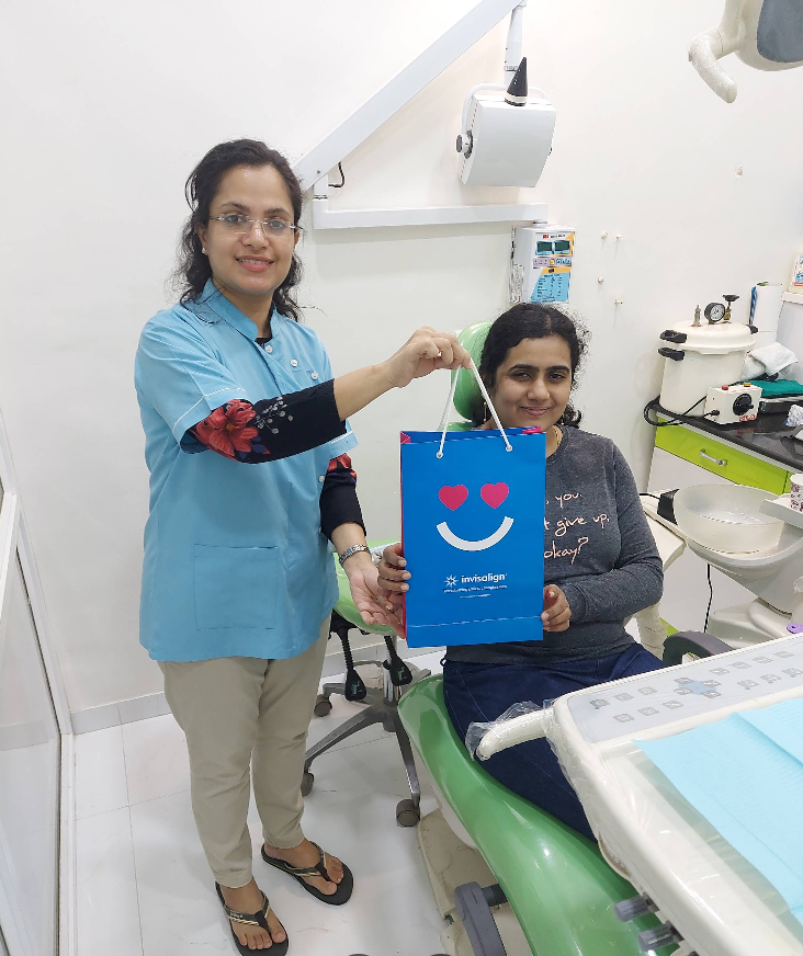 A patient with a clear-aligner gift bag at Smile Rite