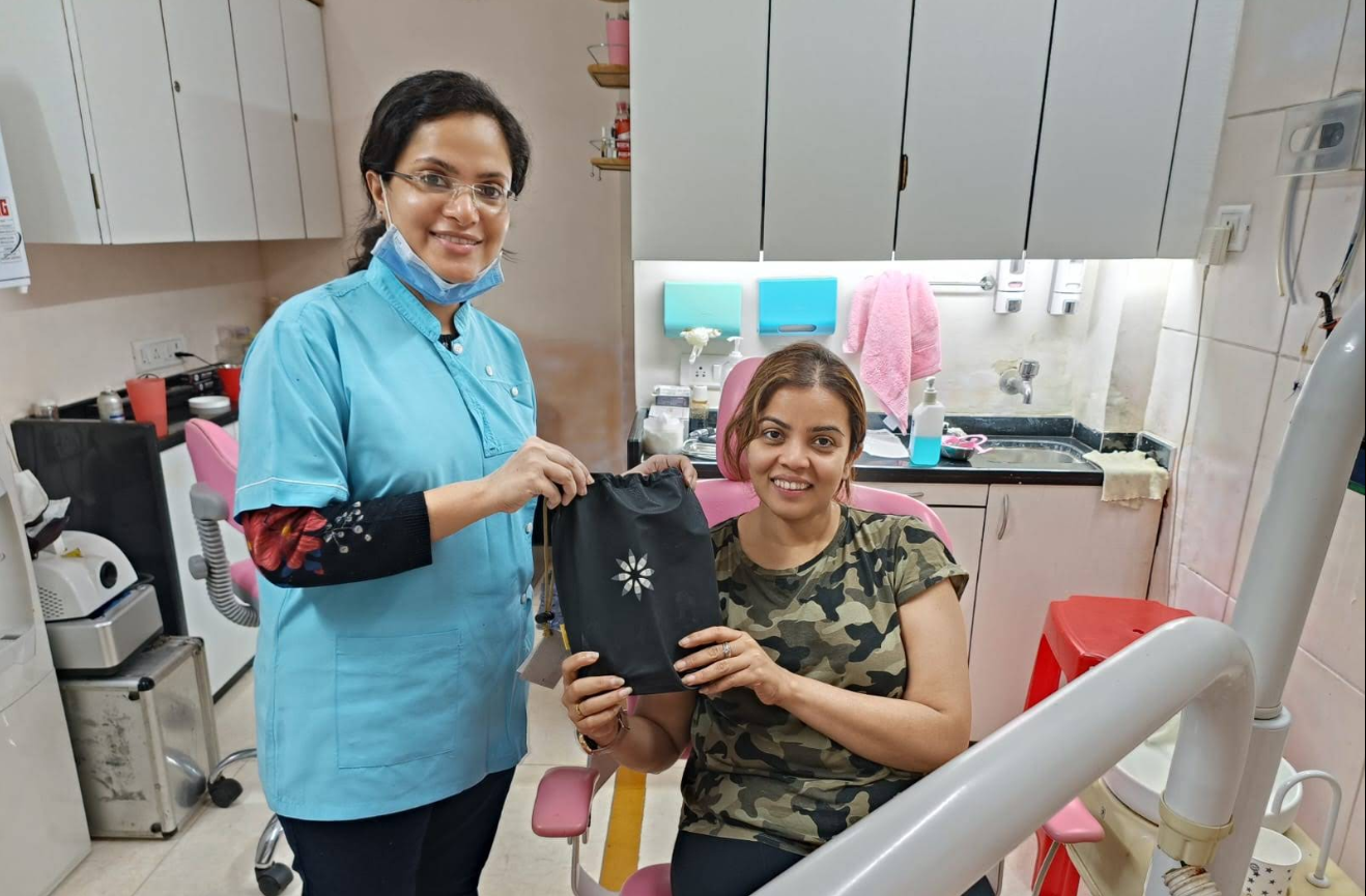A patient smiling after treatment at Smile Rite Dental Care